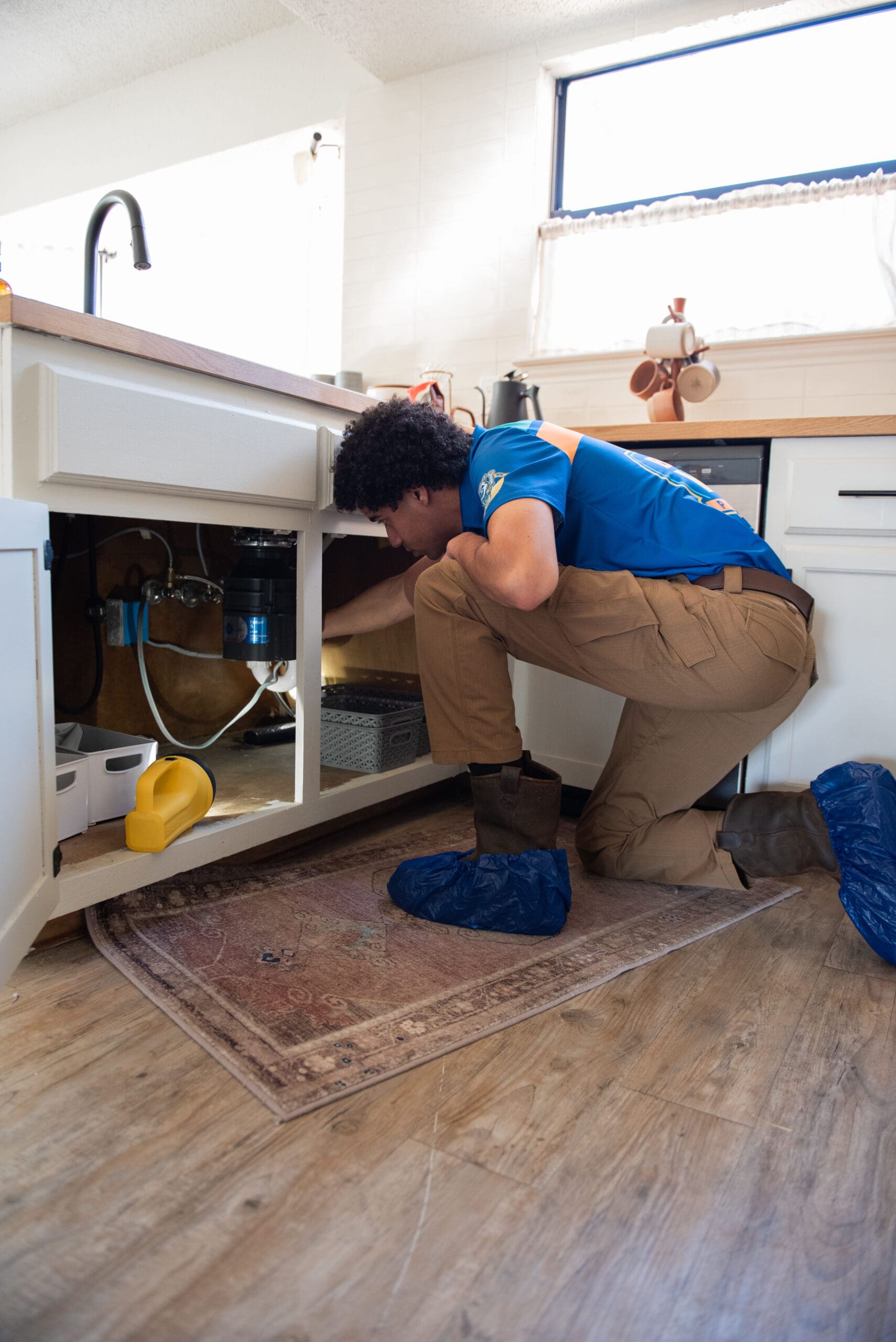 Beyond Wow Plumbing technician performing plumbing inspection
