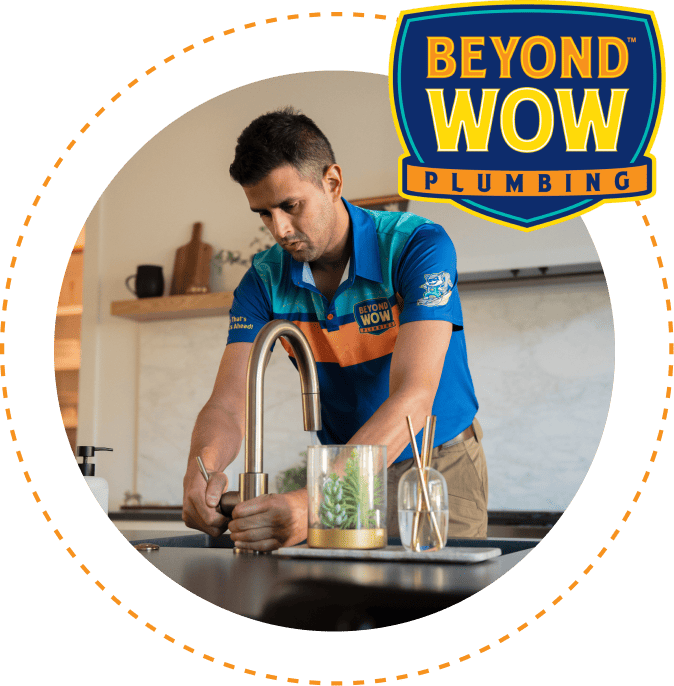 Beyond Wow Plumbing technician working on sink