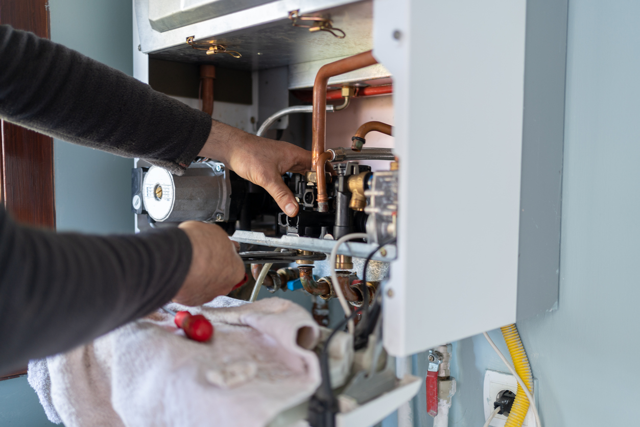 Plumber repairing a Boiler